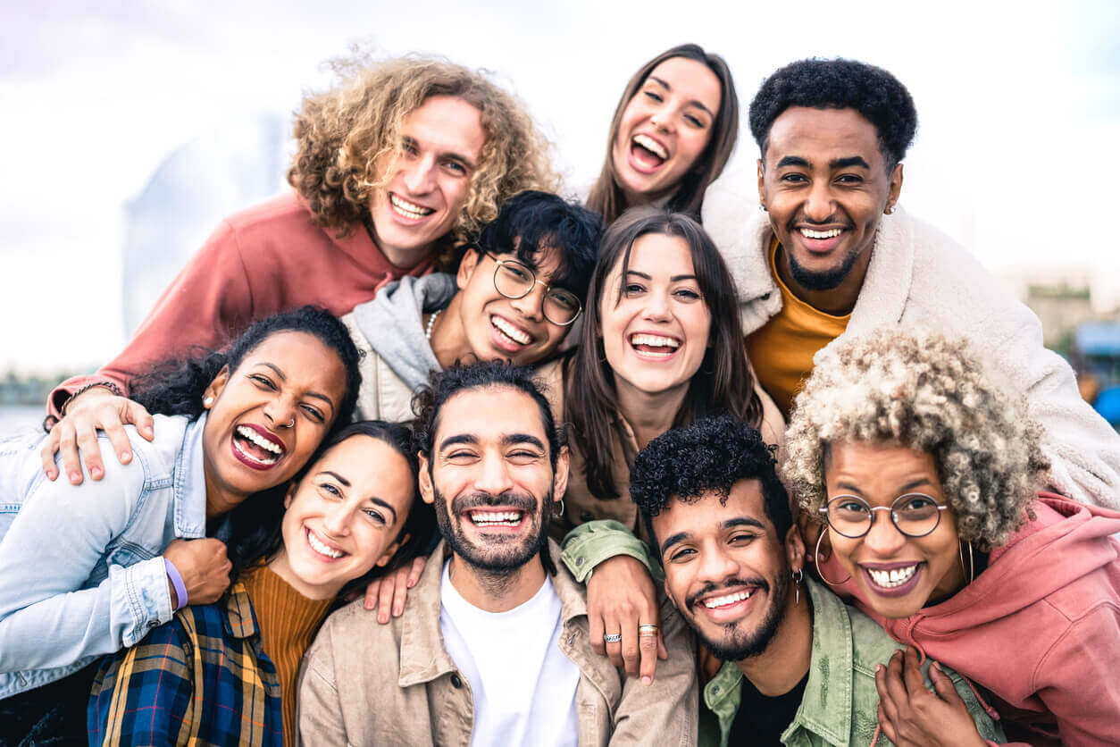 A group of very different smiling people