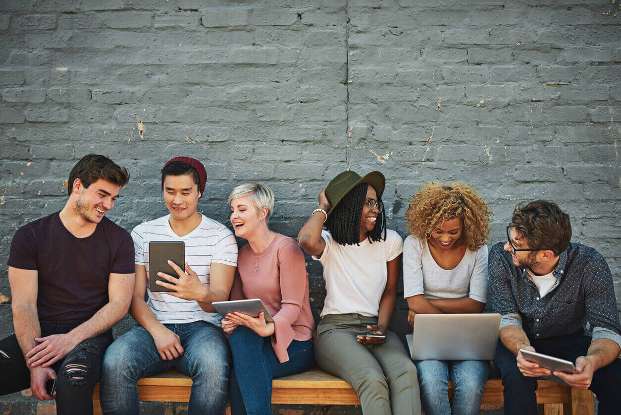 Group of smiling people having social networking