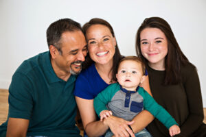 A new family adopting a baby from a young woman who chose to continue with her pregnancy